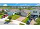 Aerial view of homes, landscaping, and lake at 5133 Chickadee St, St Cloud, FL 34771
