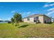 Backyard with lake view and outdoor grill at 5133 Chickadee St, St Cloud, FL 34771
