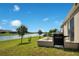 Home with lake view and built-in outdoor grill at 5133 Chickadee St, St Cloud, FL 34771