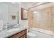 Bright bathroom featuring a vanity with granite countertop, toilet and a shower-tub combo at 5133 Chickadee St, St Cloud, FL 34771