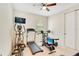 Bright exercise room with an elliptical, treadmill and a weight lifting machine at 5133 Chickadee St, St Cloud, FL 34771