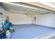 View of a spacious, clean garage with epoxy flooring at 5133 Chickadee St, St Cloud, FL 34771
