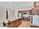 Spacious kitchen with granite countertops, stainless steel appliances, and a center island with bar seating at 5133 Chickadee St, St Cloud, FL 34771