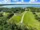Expansive acreage with a pond and lake in the distance at 5150 Gentry Oaks Pl, St Cloud, FL 34772