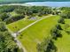 Lakefront acreage with pond, mature trees, and expansive green space at 5150 Gentry Oaks Pl, St Cloud, FL 34772