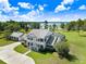 Estate with a screened pool, mature trees, and an elegant two-story house at 5150 Gentry Oaks Pl, St Cloud, FL 34772