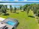 A screened pool complements a large lot and lake access at 5150 Gentry Oaks Pl, St Cloud, FL 34772