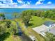 Expansive property with a screened pool, mature trees, and waterfront access at 5150 Gentry Oaks Pl, St Cloud, FL 34772