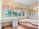 Bathroom with large tub, adjacent vanity, and large window for natural light at 5150 Gentry Oaks Pl, St Cloud, FL 34772