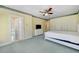 Bedroom featuring a door to a bathroom and lots of closet space at 5150 Gentry Oaks Pl, St Cloud, FL 34772