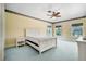Bedroom with large windows, a ceiling fan and a bed with a white frame at 5150 Gentry Oaks Pl, St Cloud, FL 34772