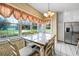Cozy breakfast nook featuring a table with seating for six and natural lighting at 5150 Gentry Oaks Pl, St Cloud, FL 34772