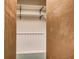 Empty closet with shelves and a hanging rod, ready for organization at 5150 Gentry Oaks Pl, St Cloud, FL 34772