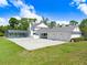 Exterior home featuring an in-ground pool, oversized garage with beautiful landscaping at 5150 Gentry Oaks Pl, St Cloud, FL 34772