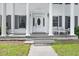 Charming front porch with classic columns, seating, and a welcoming entrance at 5150 Gentry Oaks Pl, St Cloud, FL 34772