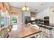 Bright eat-in kitchen features large window, custom cabinetry, and stainless steel appliances at 5150 Gentry Oaks Pl, St Cloud, FL 34772