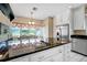 Large eat-in kitchen with stainless appliances, counter seating, and bright natural light at 5150 Gentry Oaks Pl, St Cloud, FL 34772