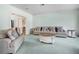 Inviting living room with comfortable seating and soft green carpet for a warm and welcoming atmosphere at 5150 Gentry Oaks Pl, St Cloud, FL 34772