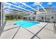 This stunning screened-in pool area offers a relaxing oasis with plenty of space for entertaining and lounging at 5150 Gentry Oaks Pl, St Cloud, FL 34772