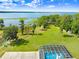 Screened in pool with lake view on sprawling acreage at 5150 Gentry Oaks Pl, St Cloud, FL 34772