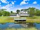 Beautiful estate home with a screened pool, a dock, and water frontage for enjoying nature at 5150 Gentry Oaks Pl, St Cloud, FL 34772