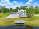 Beautiful white brick estate home with screened pool, pond and dock at 5150 Gentry Oaks Pl, St Cloud, FL 34772