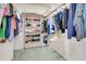 Spacious walk-in closet with shelves and hanging storage for clothes and shoes at 5150 Gentry Oaks Pl, St Cloud, FL 34772