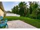 Paver patio and seating overlook the private fenced-in backyard at 56 Levee Ln, Ormond Beach, FL 32174
