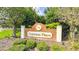 Welcoming entrance sign to Cypress Place surrounded by beautiful landscaping and lush greenery at 56 Levee Ln, Ormond Beach, FL 32174
