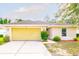 Charming one-story home featuring an attached two-car garage and a well-maintained, landscaped front yard at 56 Levee Ln, Ormond Beach, FL 32174