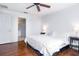 The main bedroom has hardwood floors, a ceiling fan, and an attached bathroom at 56 Levee Ln, Ormond Beach, FL 32174
