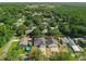 Aerial view of the property with surrounding neighborhood and some partial water views at 6479 Apple St, St Cloud, FL 34771