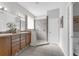 Bathroom with dual vanity and luxurious shower with a tiled bench and multiple showerheads at 6479 Apple St, St Cloud, FL 34771