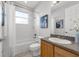Bathroom featuring a shower-tub combo, and a wood vanity at 6479 Apple St, St Cloud, FL 34771
