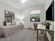 Neutral secondary bedroom with a desk and a large window at 6479 Apple St, St Cloud, FL 34771