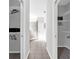 Hallway with two walk-in closets with organizers and storage at 6479 Apple St, St Cloud, FL 34771