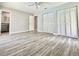 Large main bedroom features hardwood floors and a closet with louvered doors at 713 Wood Ln, Kissimmee, FL 34759