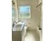 Neat bathroom featuring a single vanity and a tub with tiled walls at 721 S Clyde S Ave, Kissimmee, FL 34741