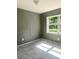 Cozy bedroom with tile flooring and natural light streaming through the window at 721 S Clyde S Ave, Kissimmee, FL 34741