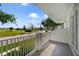 Relaxing balcony with views of the street, lawn, and surrounding landscape at 7468 Excitement Dr # 101, Reunion, FL 34747
