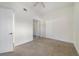 Cozy bedroom with mirrored closet doors, ceiling fan and carpet floors at 7468 Excitement Dr # 101, Reunion, FL 34747