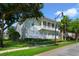 Charming two-story condo with a beautifully maintained lawn and verdant landscaping at 7468 Excitement Dr # 101, Reunion, FL 34747