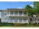 Inviting two-story condo with dual balconies and lush tropical landscaping at 7468 Excitement Dr # 101, Reunion, FL 34747