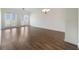 Bright living room featuring gorgeous wood floors, and ample natural light at 7468 Excitement Dr # 101, Reunion, FL 34747
