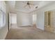 Open main bedroom with tray ceilings and an en-suite bathroom with -and- walk-in closets at 7468 Excitement Dr # 101, Reunion, FL 34747