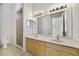 Bathroom featuring a double sink vanity and glass shower stall at 7740 Linkside Loop, Reunion, FL 34747