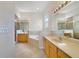 This bathroom features a garden tub, double vanity, and glass shower at 7740 Linkside Loop, Reunion, FL 34747