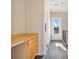 Hallway with a built-in desk area and view of the front door at 7740 Linkside Loop, Reunion, FL 34747