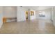 Open floor plan showcasing tile flooring, built in desk, and a pass-through to the kitchen at 7740 Linkside Loop, Reunion, FL 34747