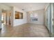 Bright living and dining area with tile floors and access to kitchen and backyard at 7740 Linkside Loop, Reunion, FL 34747